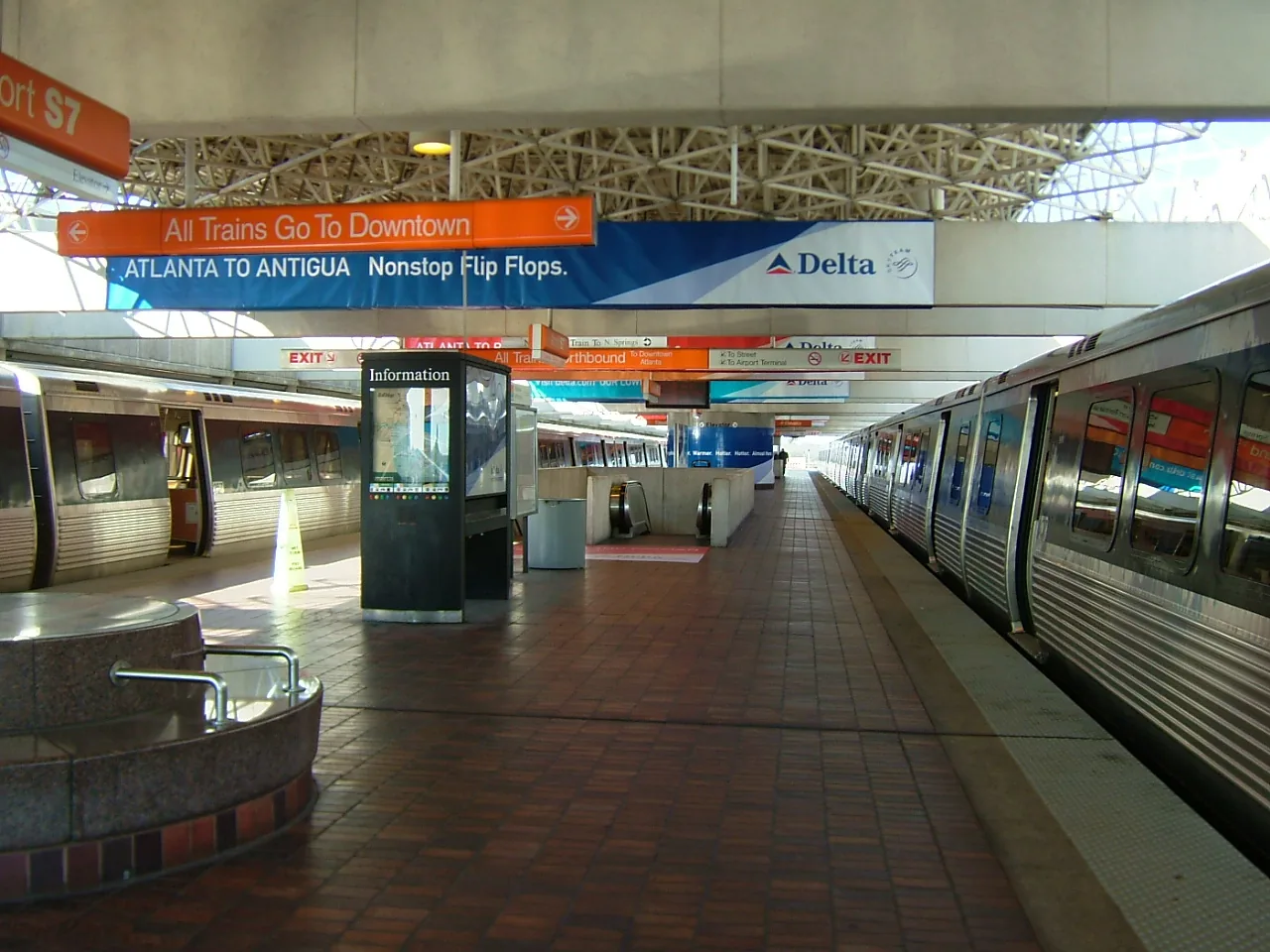 The MARTA platform inside the Atlanta airport station, with a train waiting.