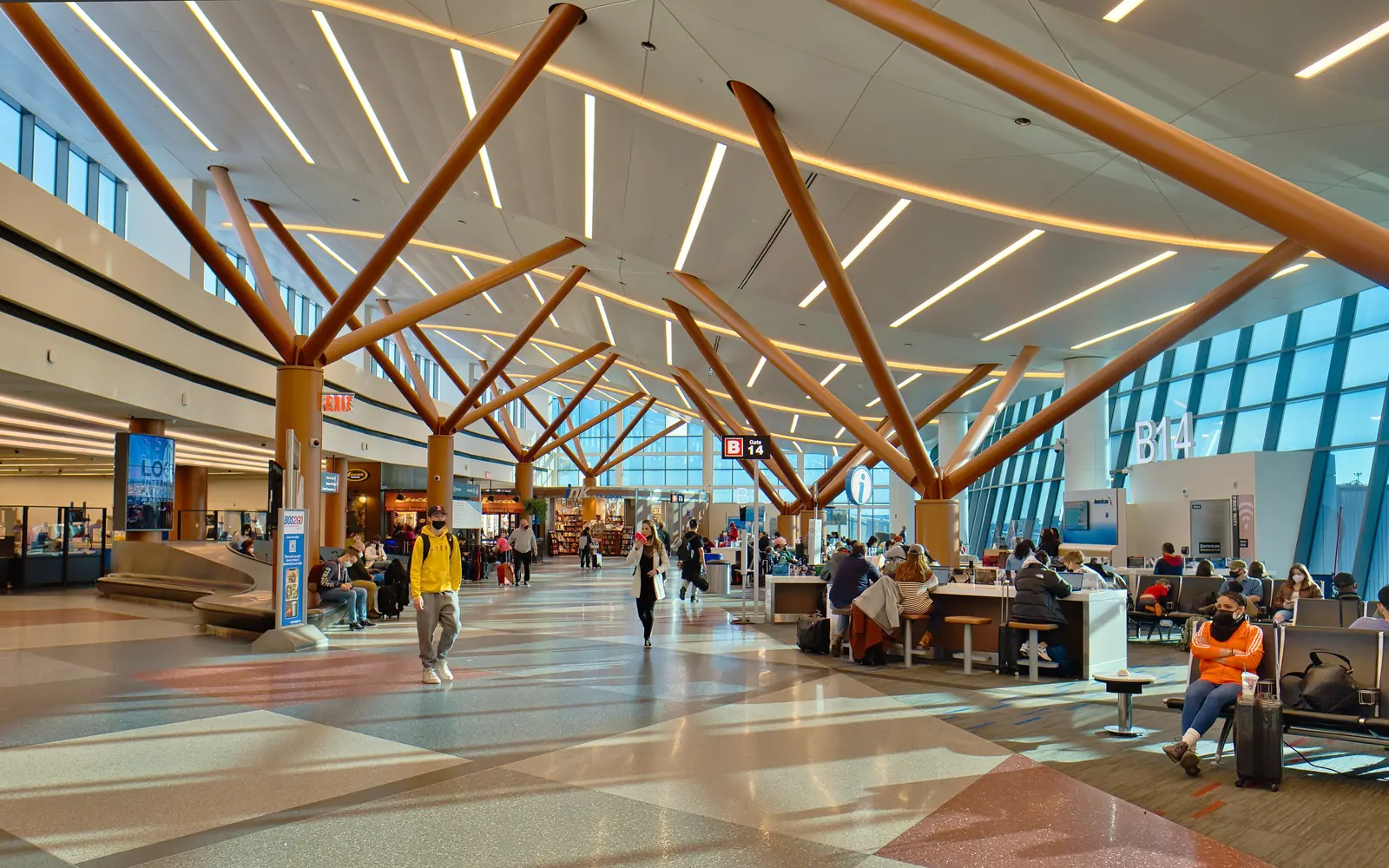 A concourse at Boston Logan, under its timber roof structure.