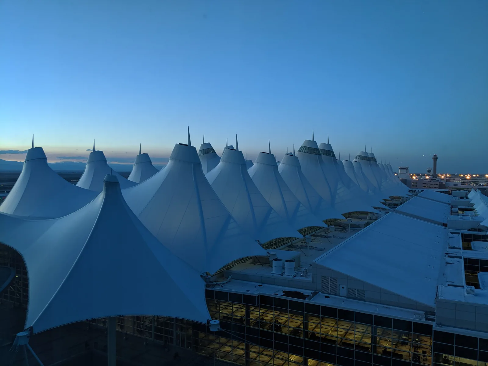 The tent roof over Denver's Jeppesen Terminal at dusk.