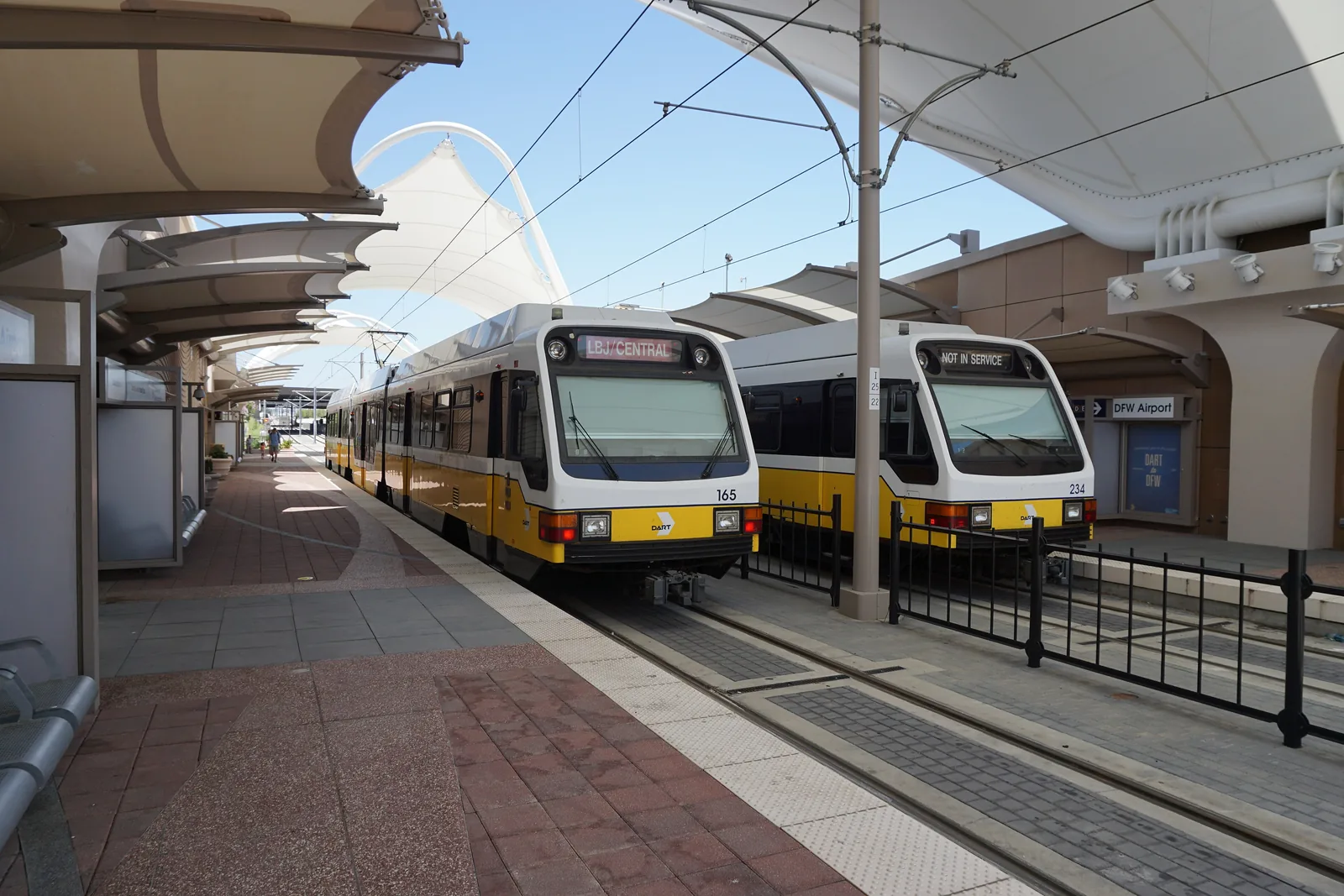 DART trains at the DFW Airport station platform.
