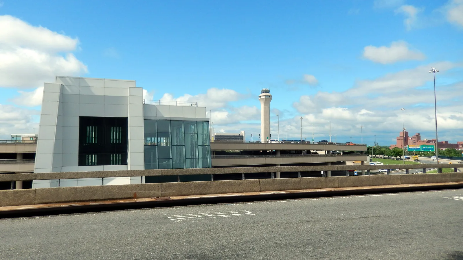 The terminal and control tower at Newark Liberty, seen from the roadway.