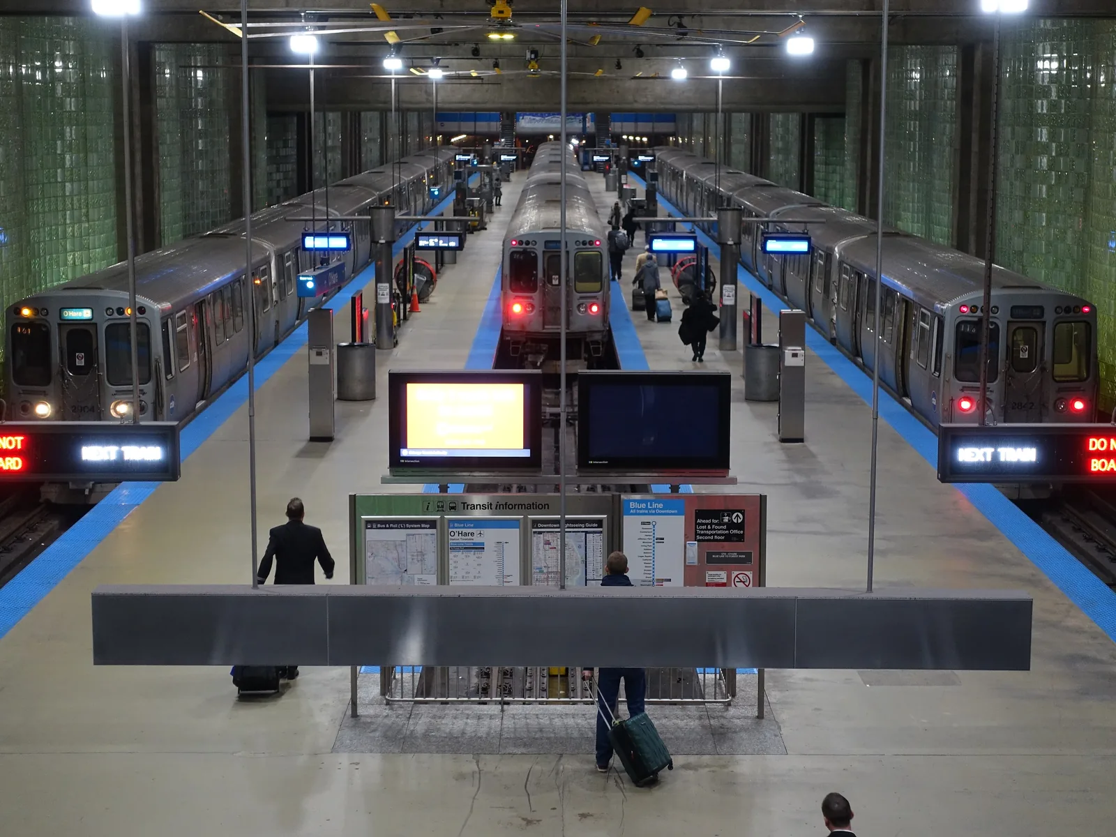 The CTA Blue Line terminus under O'Hare, with trains at both platforms.