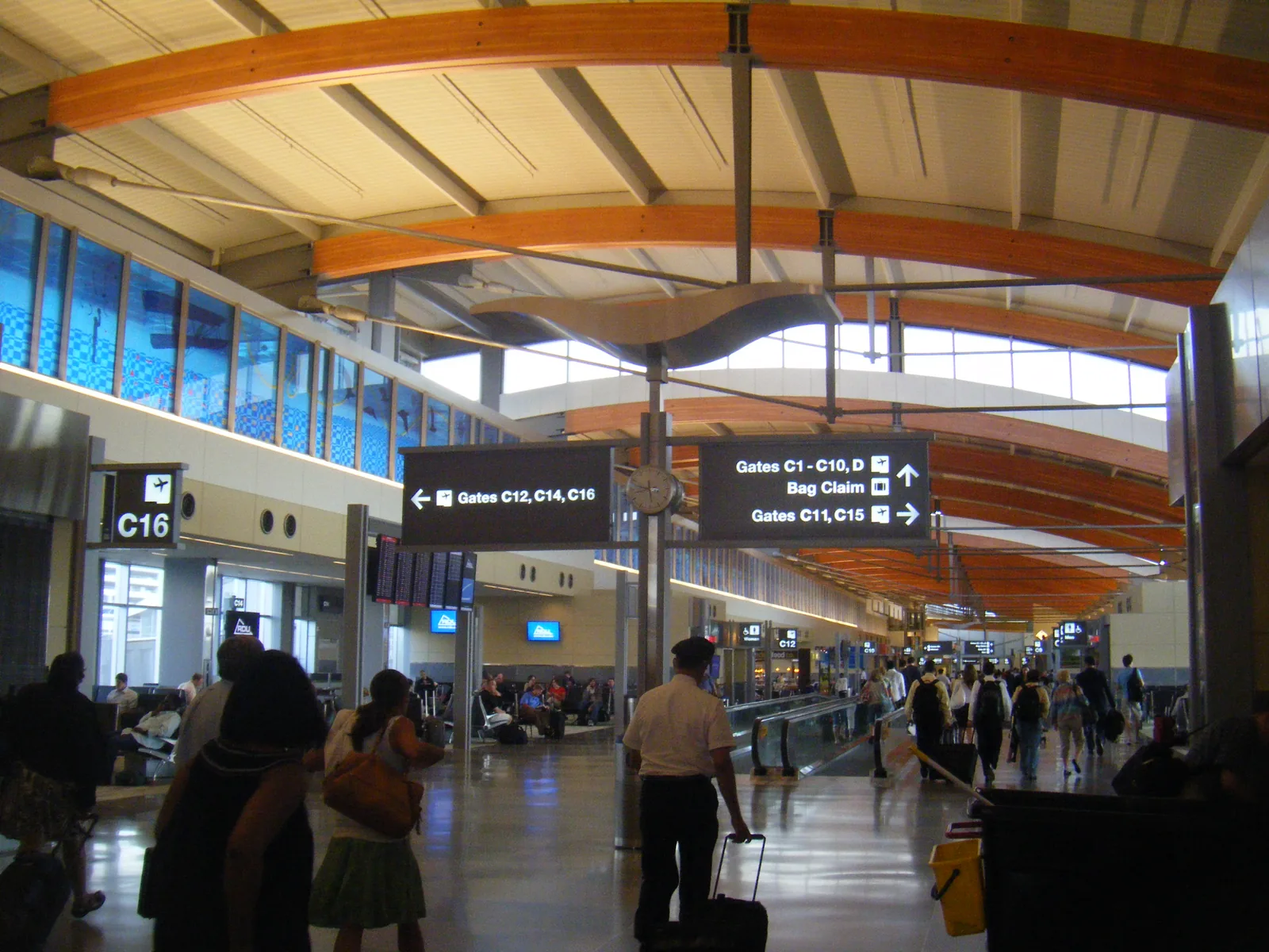 The concourse inside Terminal 2 at Raleigh-Durham International Airport, under its curved wooden roof.