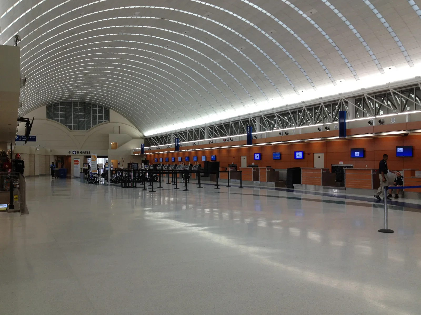 The ticket counters in Terminal B at San Antonio International Airport under its barrel-vaulted roof.