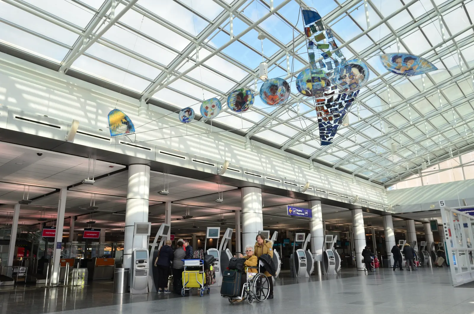The departures hall at Montreal-Trudeau, under its glass roof.