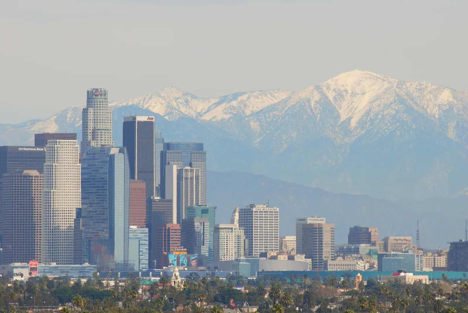 The downtown Los Angeles skyline with the San Gabriel Mountains behind it, seen from Baldwin Hills.