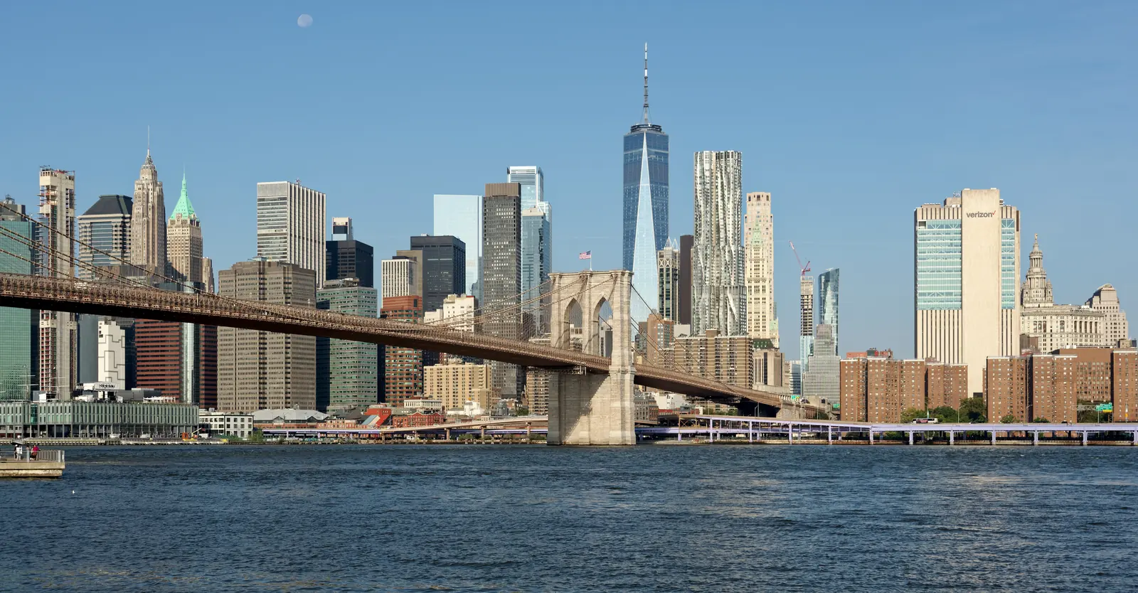 The Brooklyn Bridge with Lower Manhattan behind it, seen from the Brooklyn shore.