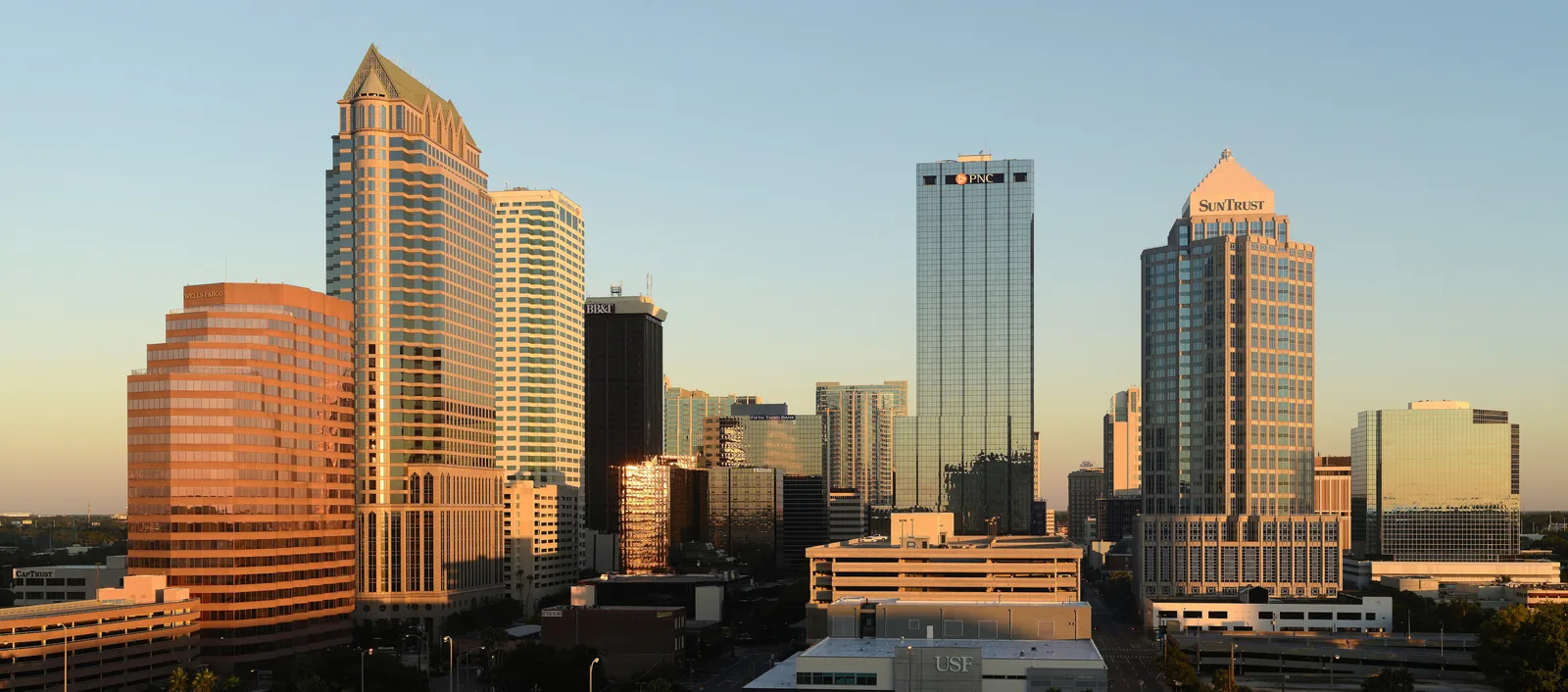 Downtown Tampa near sunrise, seen from across the Hillsborough River.