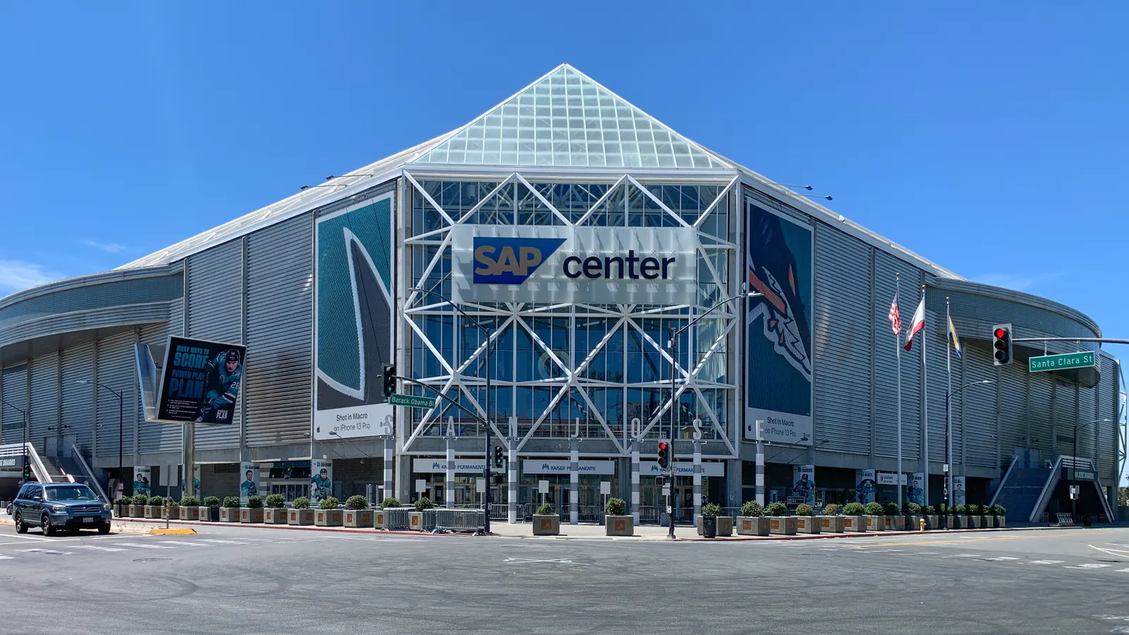 The glass front of SAP Center in San Jose, with the arena name above the entrance doors.