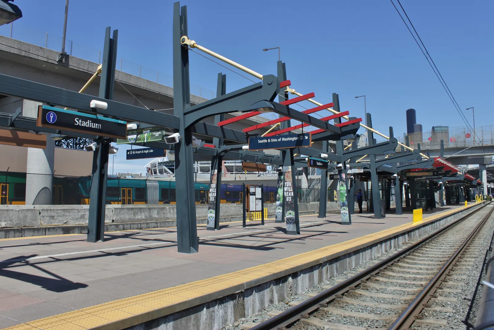 Stadium station on the Link light rail line, with the downtown Seattle skyline behind it.