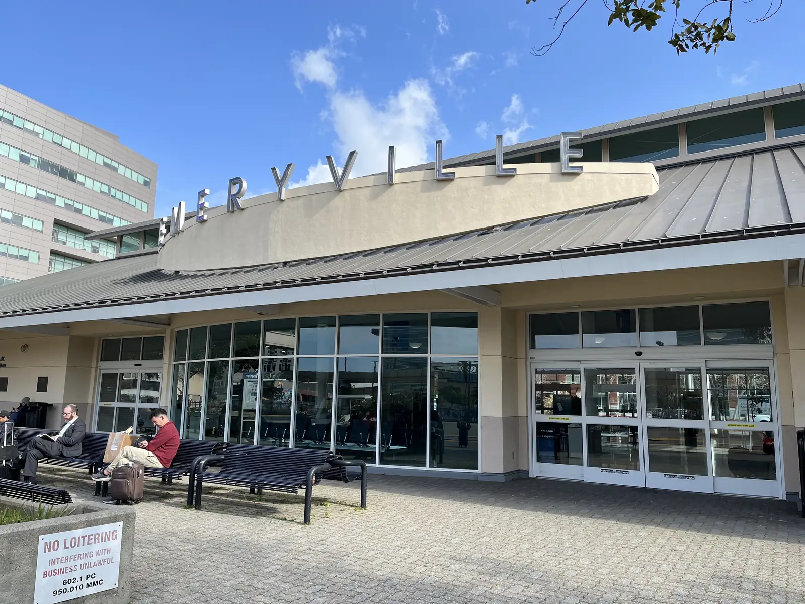 The entrance to Emeryville station, with the station name above the doors.