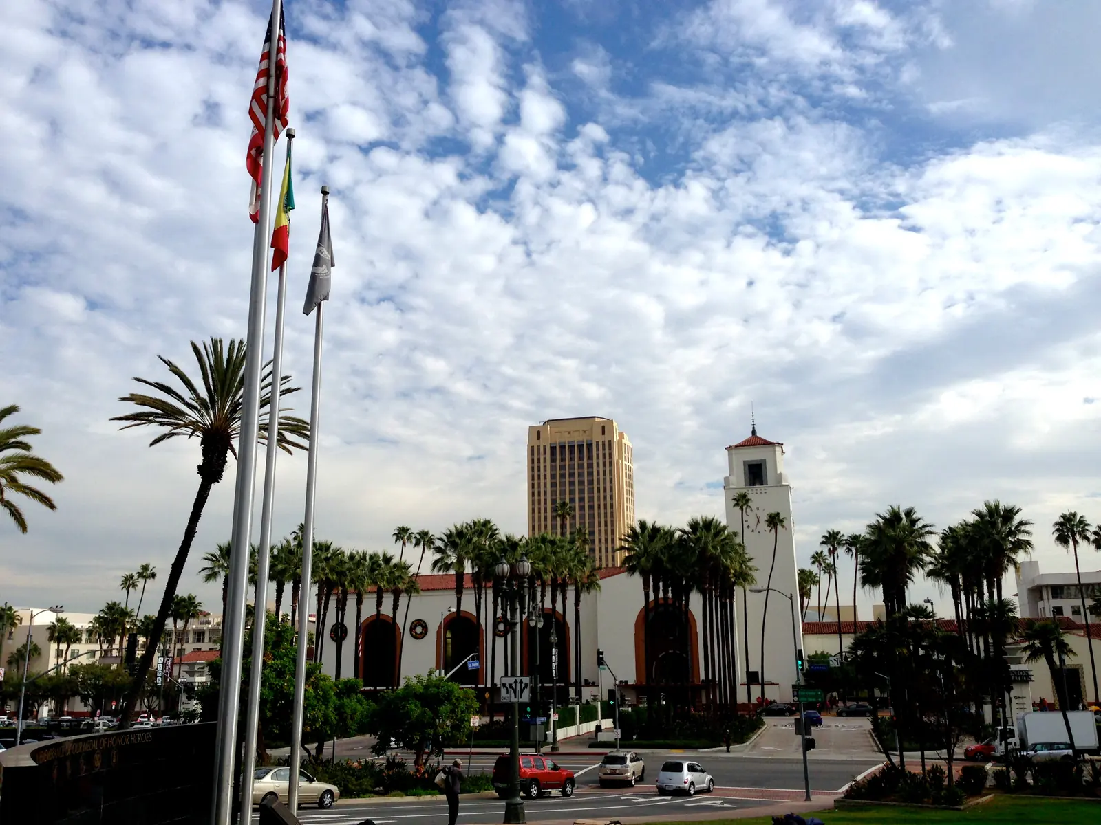 The mission-style front of Los Angeles Union Station, with its clock tower and palm trees.