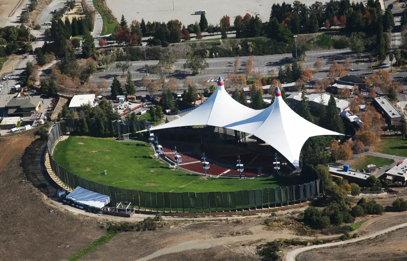 Shoreline Amphitheatre from the air, its lawn and tent roof ringed by the parking lots