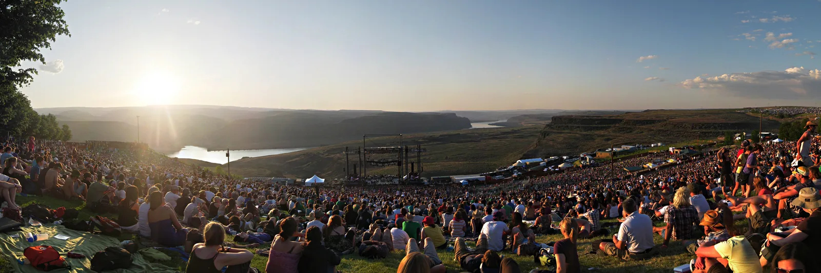 The Gorge from the top of the lawn at sunset, the crowd running down to the stage with the Columbia River canyon behind it.